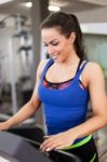 Woman Running On Treadmill Stock Photo