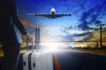 Young Business Man Standing With Luggage On Urban Airport Runway Stock Photo