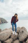 Woman On A Rock Near Cabo Da Roca In Portugal Stock Photo