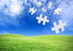 Falling Puzzle Pieces Stock Photo