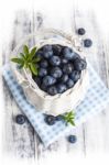 Blueberry Basket On White Wooden Table Stock Photo