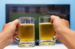 Beer In Front Of The Television Stock Photo