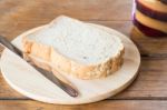 Whole Grain Bread On Wooden Plate Stock Photo