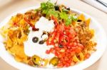 Fresh Nachos And Vegetable Salad With Meat Stock Photo