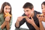 Teenagers Eating Pizza Stock Photo