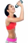 Young Woman In Gym Holding Sipper Bottle Stock Photo