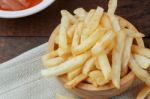 French Fries On Wooden Stock Photo