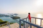 Woman On The Peak Mountain Stock Photo