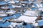 Roof Of Jeonju Traditional Korean Village Covered With Snow, Jeonju Hanok Village In Winter, South Korea Stock Photo