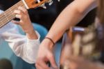 Boy And Woman Playing Guitar Stock Photo