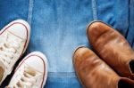 Shoes On A Denim Jacket Stock Photo