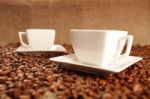 Cups With Coffee And Coffee Beans Stock Photo