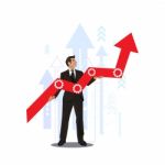 Young Businessman Holding Arrow Going Up. Successful Businessman With Growth Graph Stock Photo