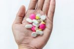 Top View Of The Pills On The Hand And White Background, A Hand Hold The Pills And Drug Stock Photo