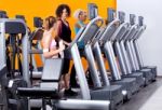 Lady Instructor In Gym Stock Photo