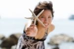 Lady Holding Starfish Stock Photo