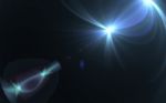 Abstract Lens Flare Lights And Black Background Stock Photo