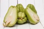 Chayote Fruit On White Wood Background Stock Photo