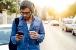 Modern Young Man With Mobile Phone In The Street Stock Photo