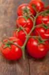 Fresh Cherry Tomatoes On A Cluster Stock Photo