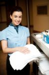 Female Holding Towel Stock Photo