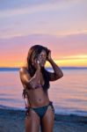 Beautiful Black African American Woman Posing On The Beach At Su Stock Photo