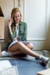 Young Beautiful Woman Moving In New Home Stock Photo