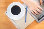 Hot Cup Of Coffee On Working Table Stock Photo