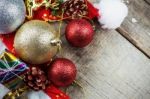 Ball And Gift On Wooden Stock Photo