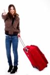 Young Female Traveller Showing Thumbs-up Stock Photo