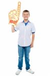 Young Boy Wearing Foam Hand Stock Photo