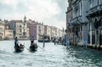 Gondoliers Ferrying People In Venice Stock Photo