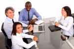 Multi Ethnic Team During Meeting Stock Photo