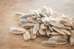 Sunflower Seeds On Weathered Wood Stock Photo