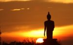 Silhouette Of Buddha Statue Stock Photo