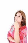 Studio Portrait Of A Beautiful Young Woman With A Thinking Expre Stock Photo