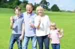 Cheerful Family Holding Yummy Ice Cream Cones Stock Photo