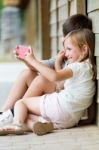 Happy Young Brothers Taking Selfies With Her Smartphone In The P Stock Photo