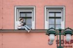 Mannequin Sitting On A Windowledge In Weimar Stock Photo