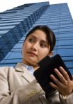 A Businesswoman Writing In A Personal Organizer Stock Photo