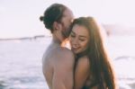 Couple Is Giving Each Other Hug At The Beach When Is Sunset Stock Photo