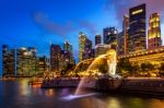 Merlion Statue And Cityscape In Singapore Stock Photo