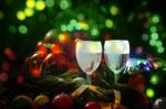 Two Glasses Of Champagne With A Christmas Decor In The Background Stock Photo