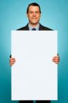 Corporate Man Holding Big White Blank Billboard Stock Photo