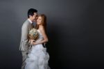 Young Asian Groom And Bride Posing And Smiling In Studio For Pre Stock Photo