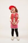 Little Girl Fashion Model With Red Cap Stock Photo