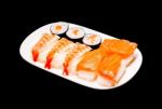 Sushi In White Plate On Black Background Stock Photo