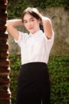 Thai Adult Student University Uniform Beautiful Girl Relax And Smile Stock Photo