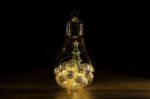 Christmas Tree With Christmas Lights In Glass Light Bulb Stock Photo