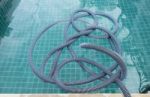 Swimming Pool Vacuum Hose Stock Photo